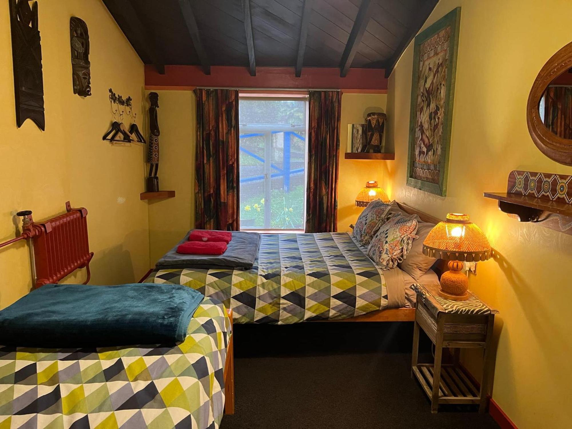 Global Village Travellers Lodge Greymouth Exteriér fotografie The bedroom at the Old School House